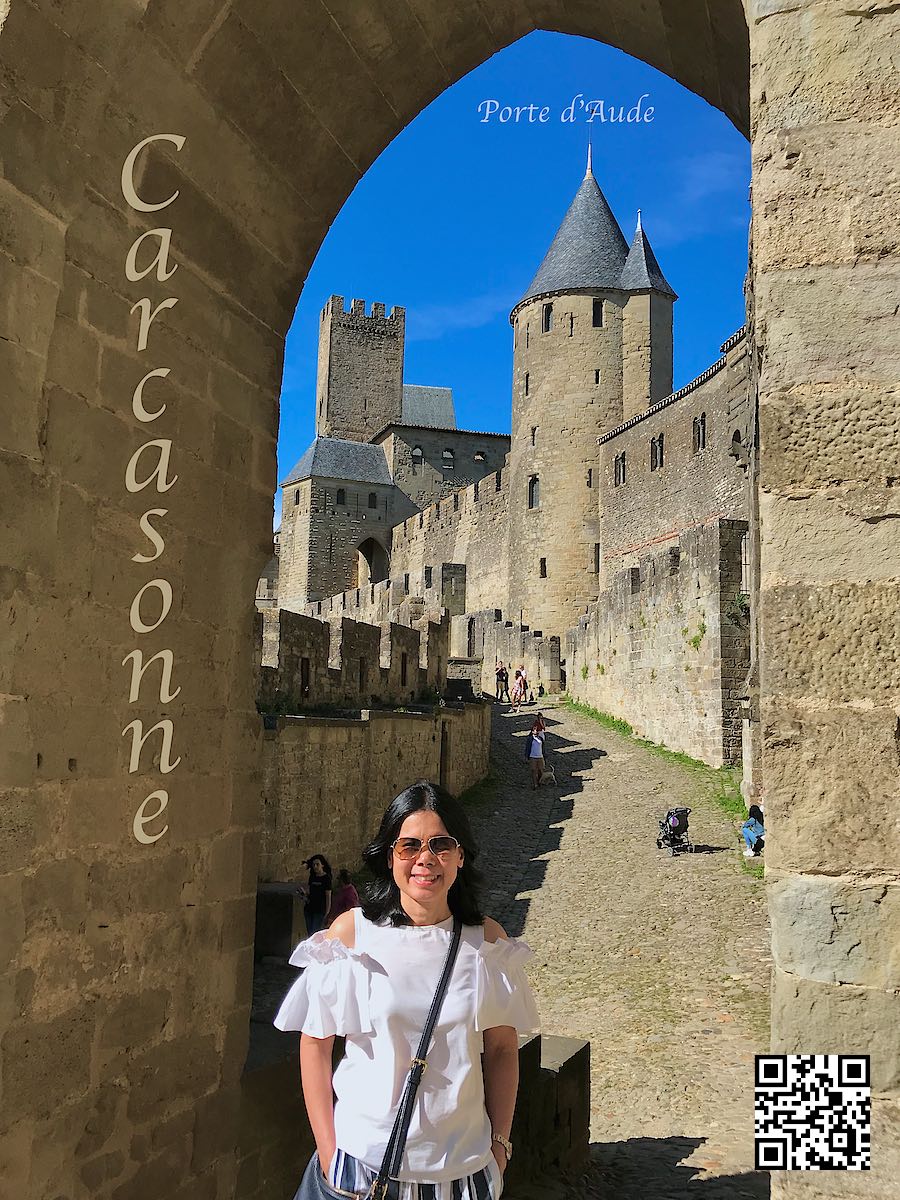 France Carcassonne La Cité Médiévale woman at Porte de l