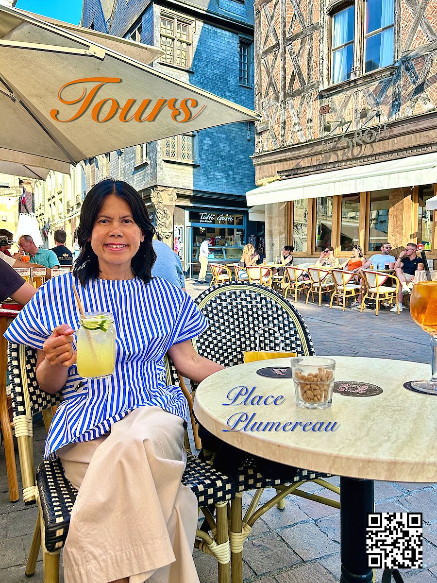 France Loire Tours Place Plumereau woman having a drink at the square