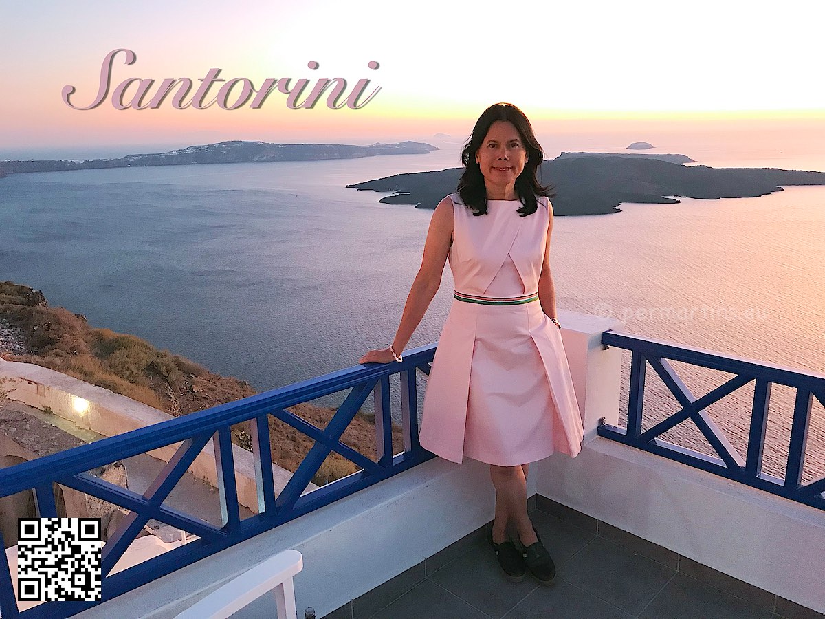 Greece Santorini Firostefani caldera sunset woman in pink dress