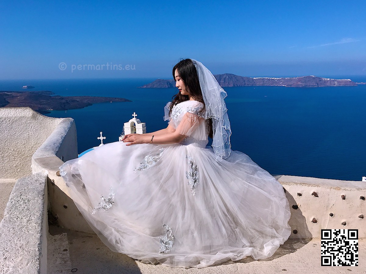 Greece Santorini Firostefani wedding bride above Three Bells of Fira church