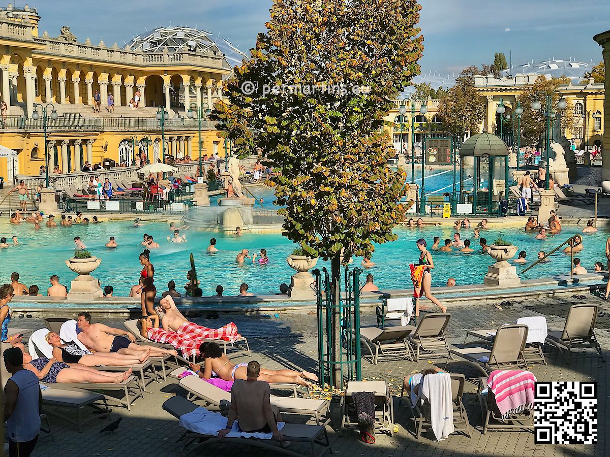 Hungary Budapest view over Széchenyi thermal bath spa pool people swimming and sunbathing