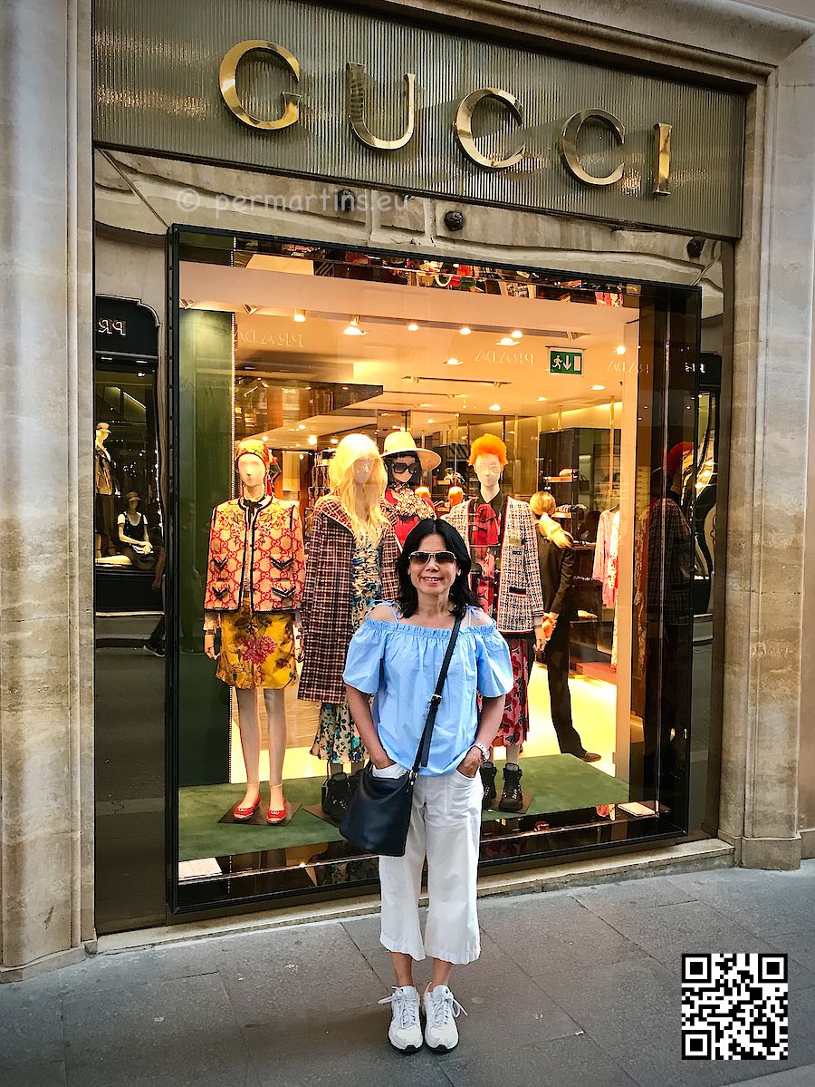 Italy Rome Via dei Condotti woman standing in front of shop